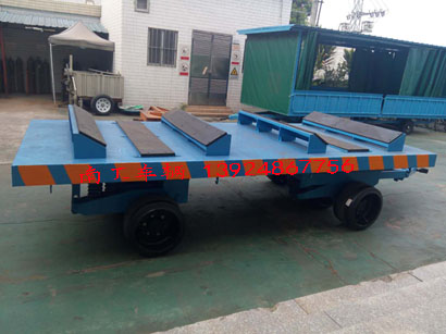 1676945603615331.jpg 30吨重型铁皮卷圆桶专用平板车3I.jpg